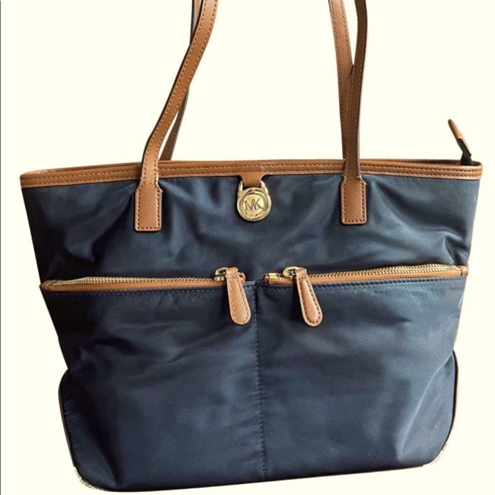 Michael Kors Nylon bag w/Some wear & tear @straps. Inside is in great condition.